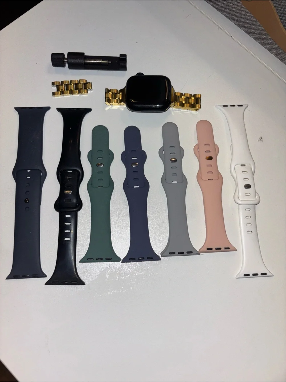 Apple Watch Series 9 (GPS) with Gold Metal Band, and 7 additional silicone bands